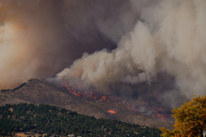 wildfire spreading across a mountain 
